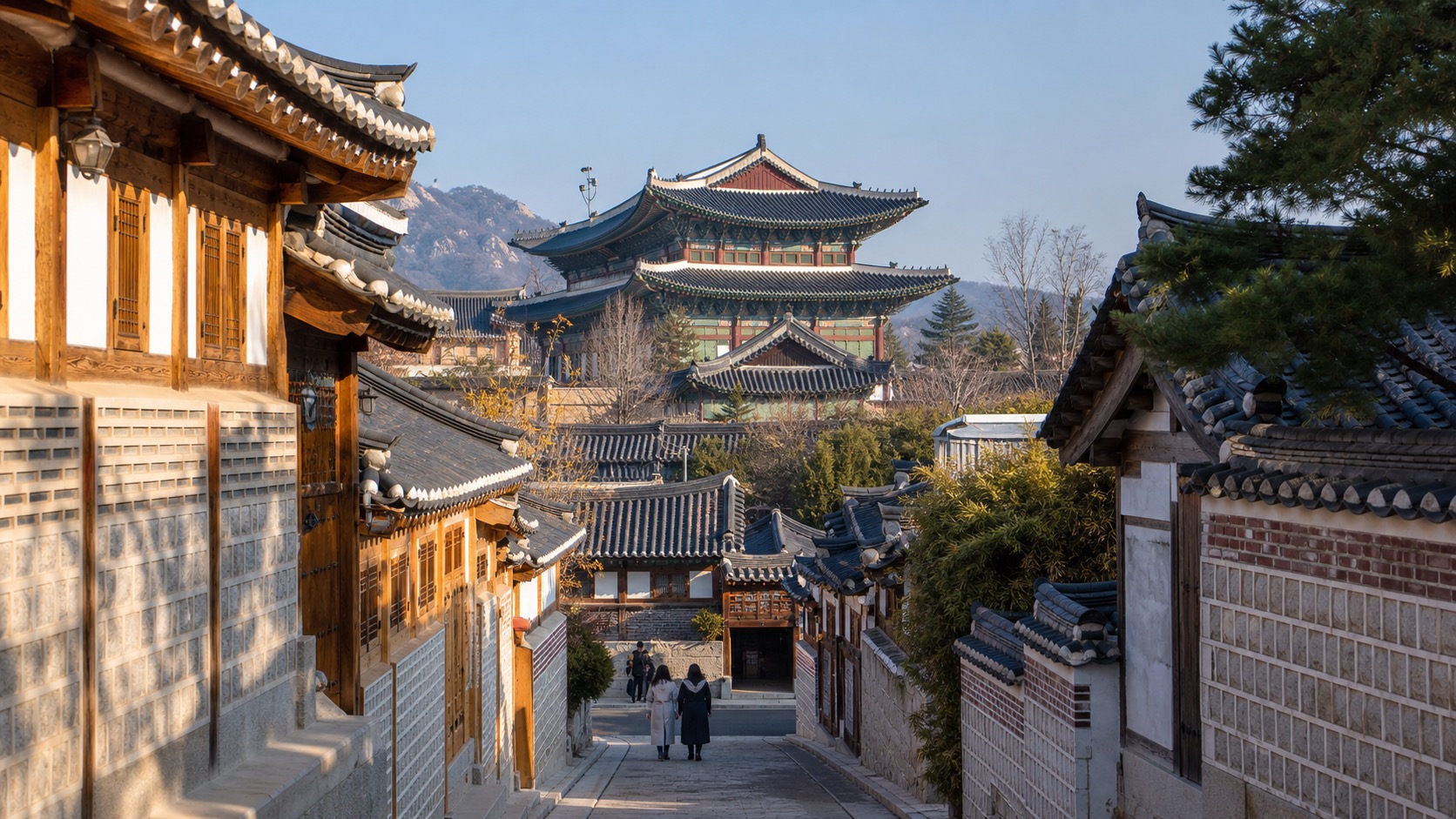 Gyeongbokgung palace roof and Bukchon hanok street in Seoul morning light