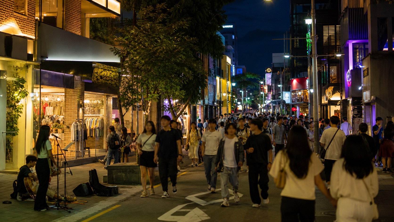 Hongdae nightlife street with shops and pedestrians in Seoul